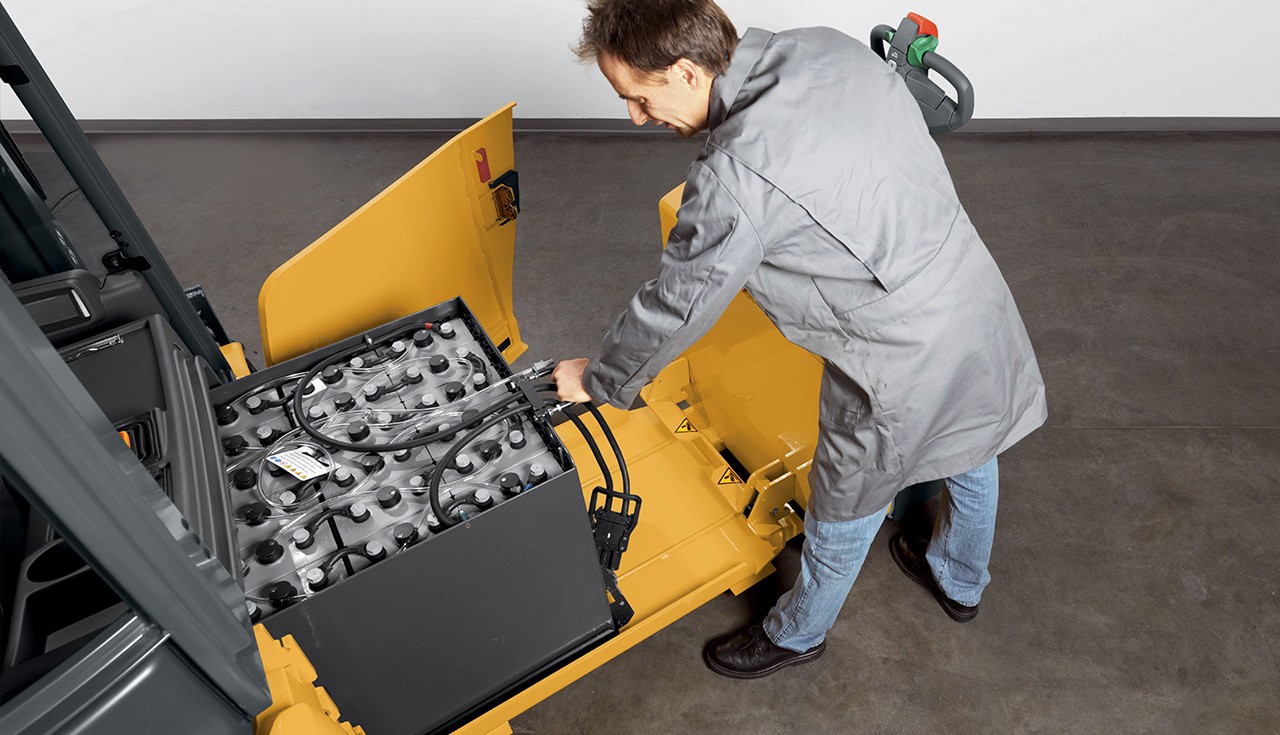 Technician working on forklift battery