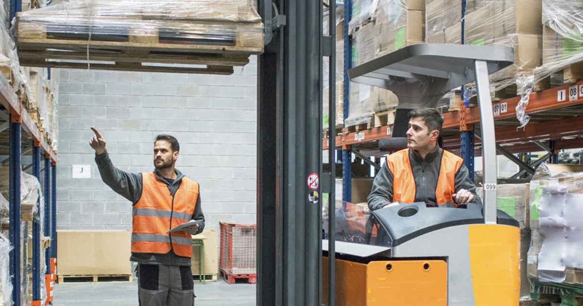 Two men in warehouse