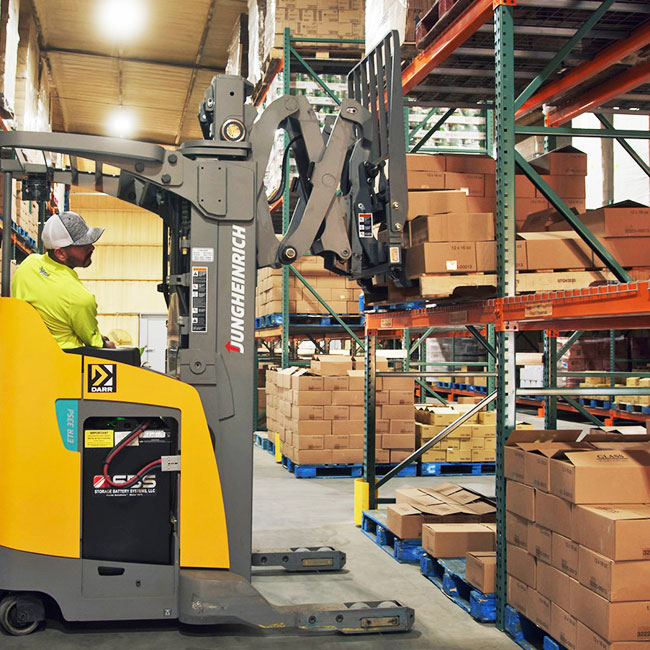 Jungheinrich forklift in warehouse aisle